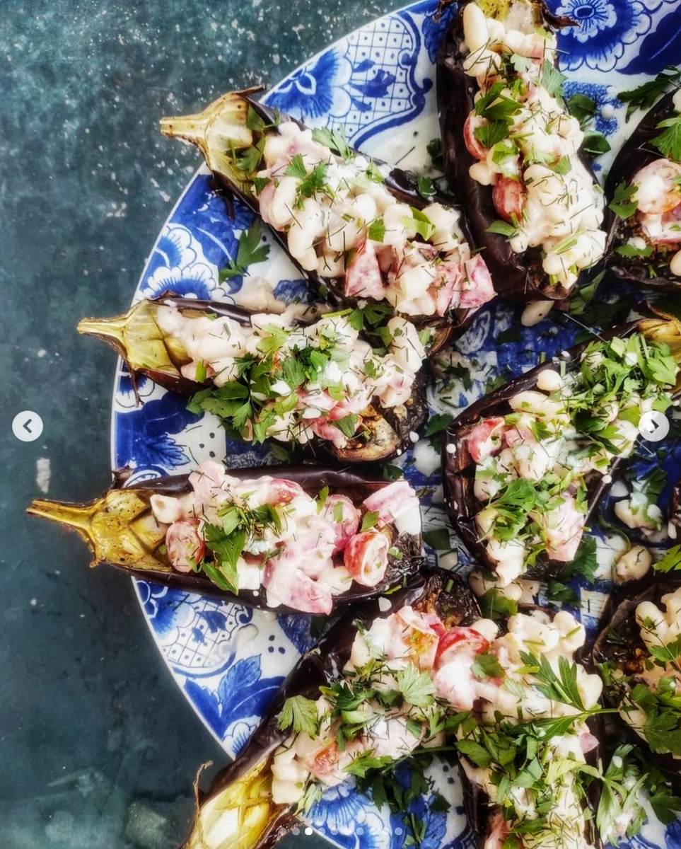 Roasted aubergines on a blue plate