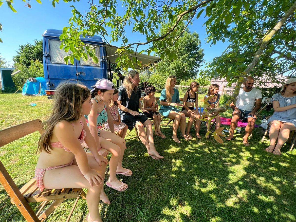 Families sitting in a circle in the garden
